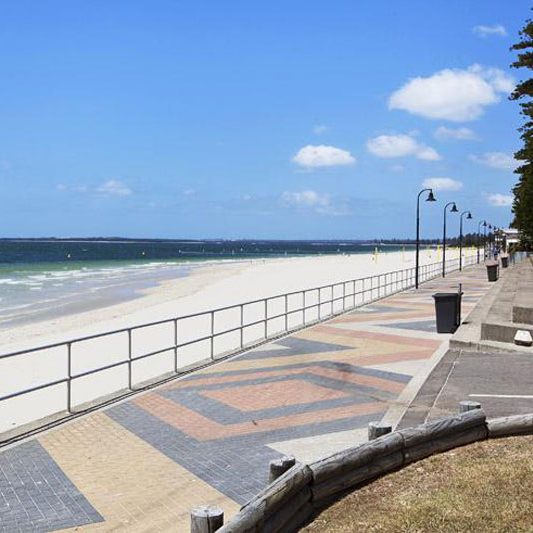 Sunny beach and boardwalk