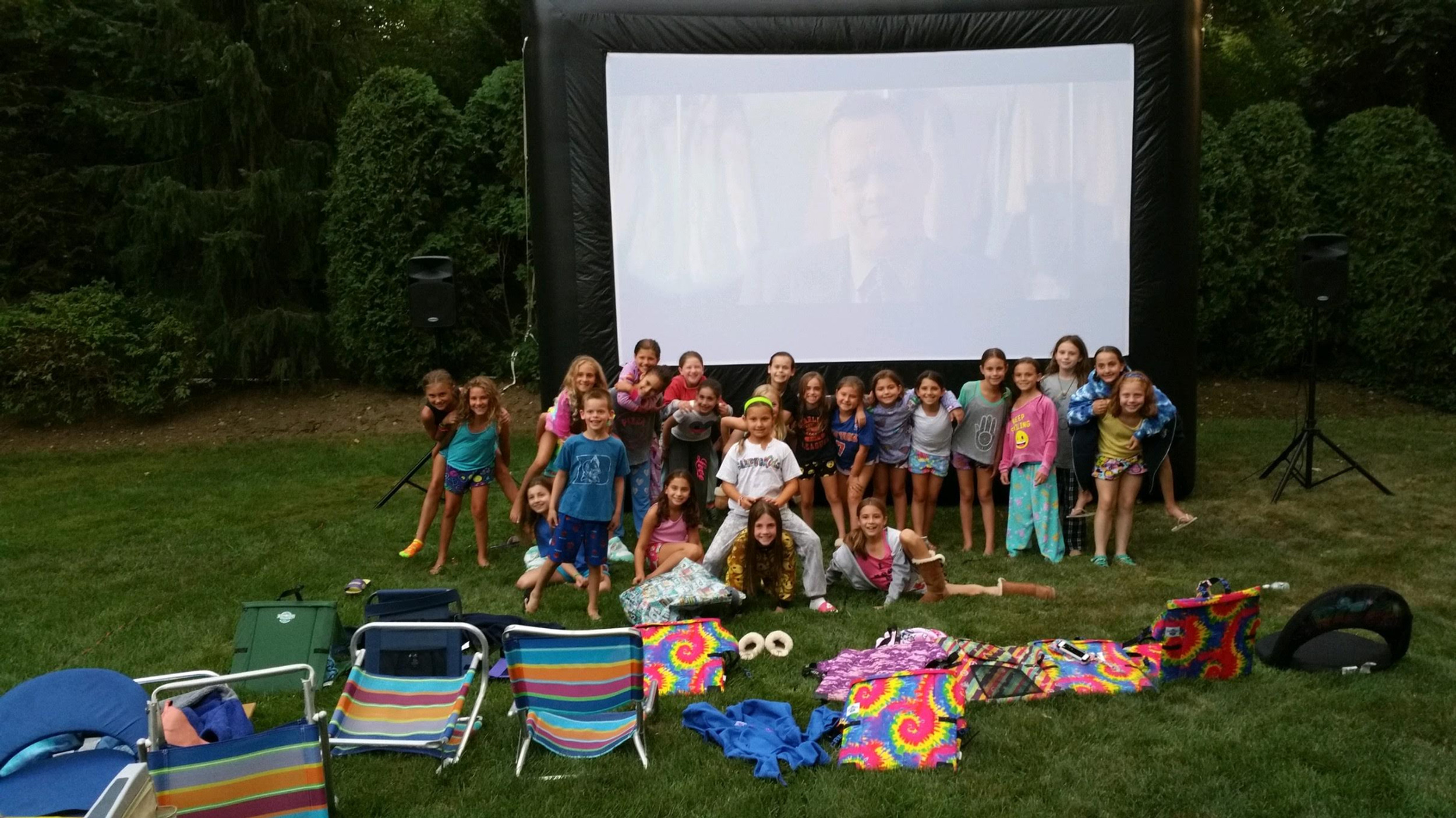 Children Enjoying an Outdoor Movie Night